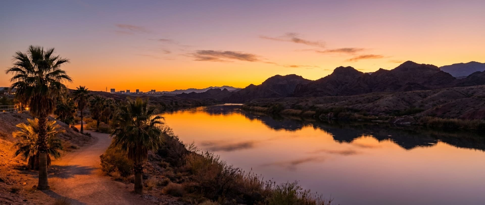 Colorado River at Laughlin, Nevada at dusk — representative imagery of the riverfront resort corridor