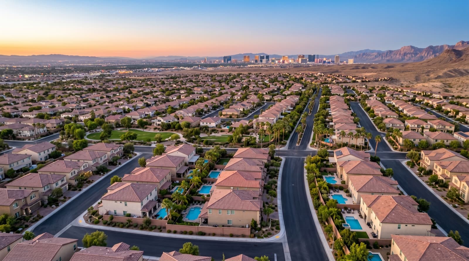 New construction homes in Skye Canyon and Tule Springs area, North Las Vegas, 2026 — residential aerial with Strip view