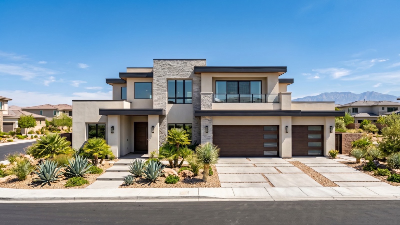 Modern two-story Las Vegas Valley home with stone accents, a three-car garage and desert landscaping