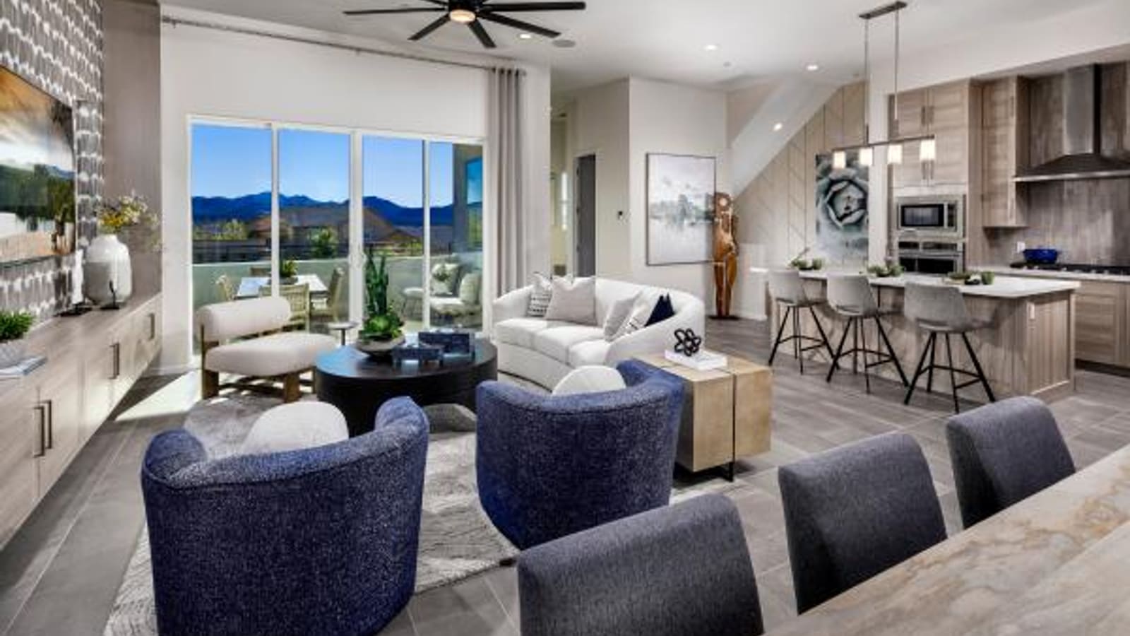 Interior view of a spacious townhome living room with large windows