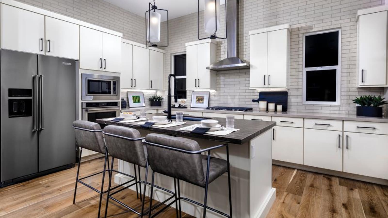 Modern townhome kitchen with stainless steel appliances and an island counter