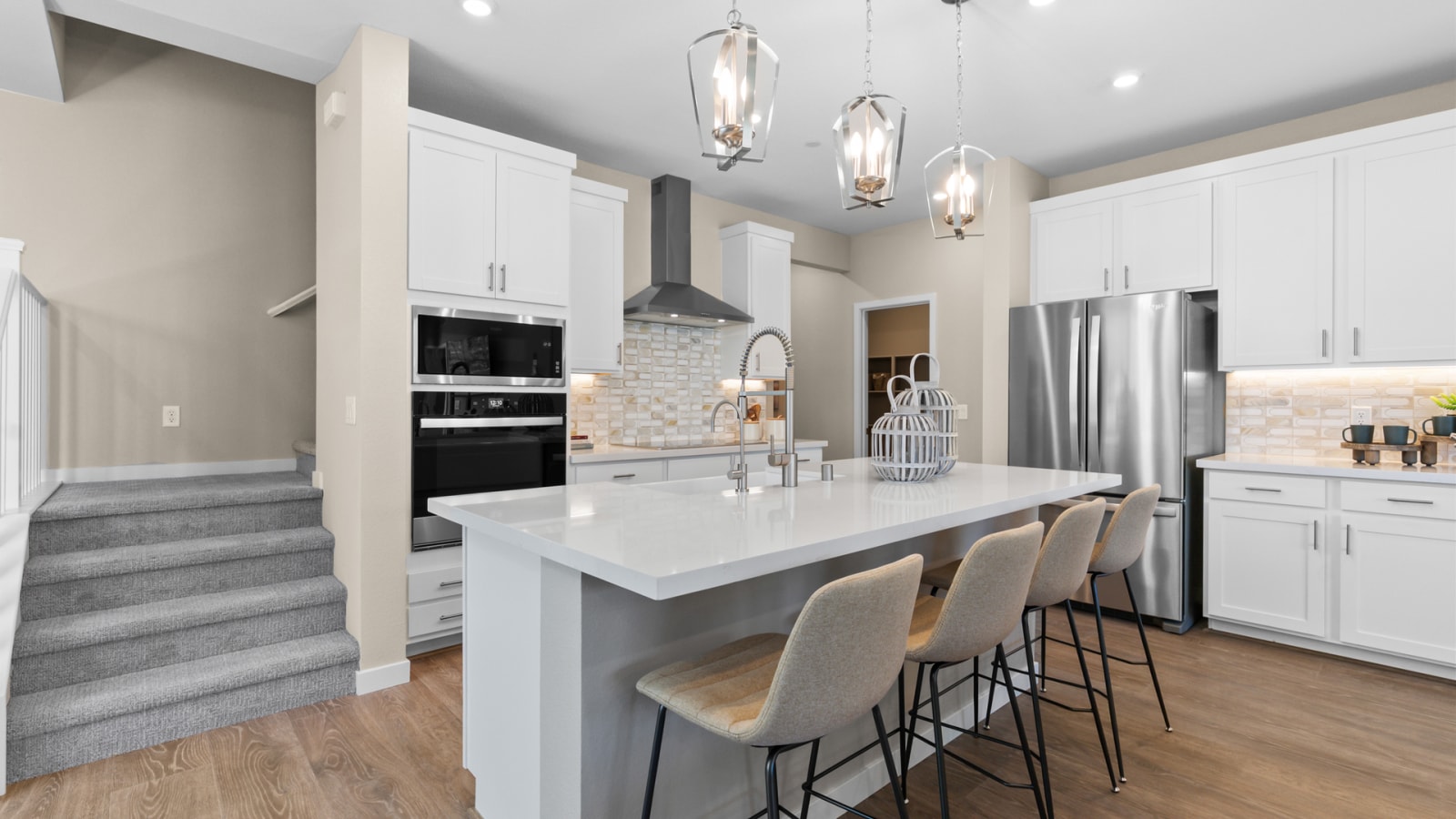 Beazer's published Sequoia model kitchen with a quartz island and surrounding cabinetry