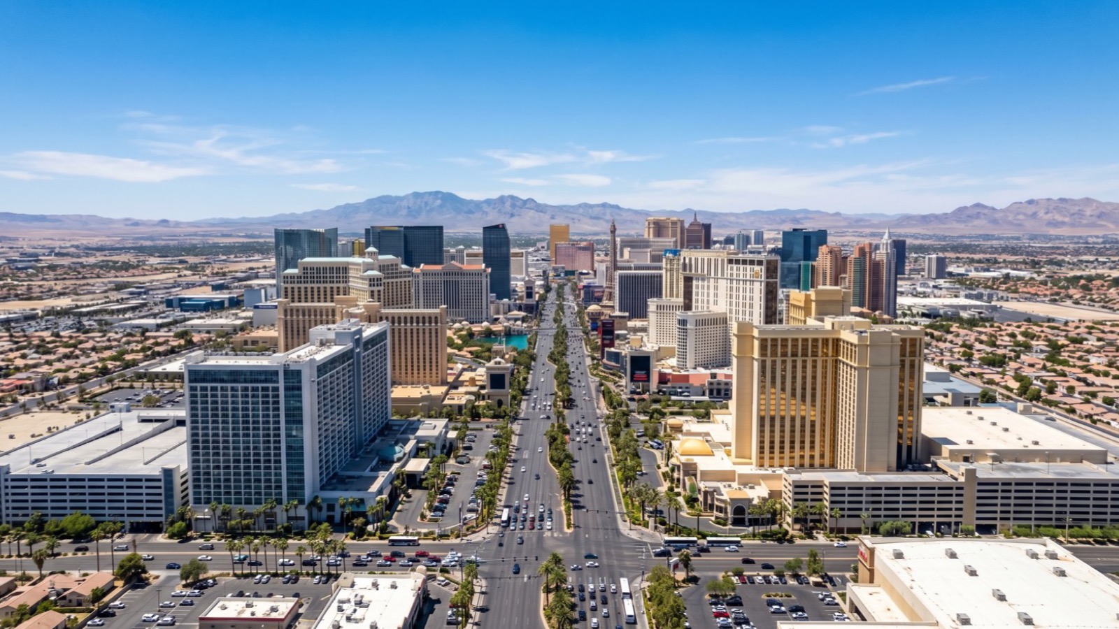 Daytime view of the Las Vegas Strip skyline with resort towers and high-rise condominiums under a clear sky