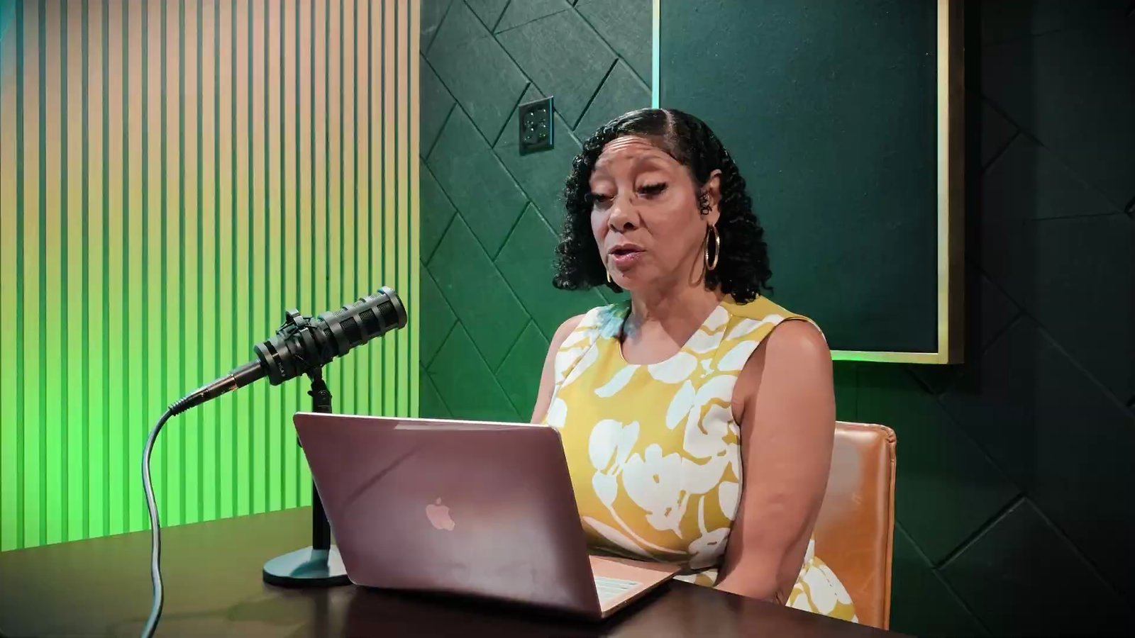 Mia Green of Nevada Real Estate Group explaining guard-gate entry procedures in the Las Vegas Playbook studio