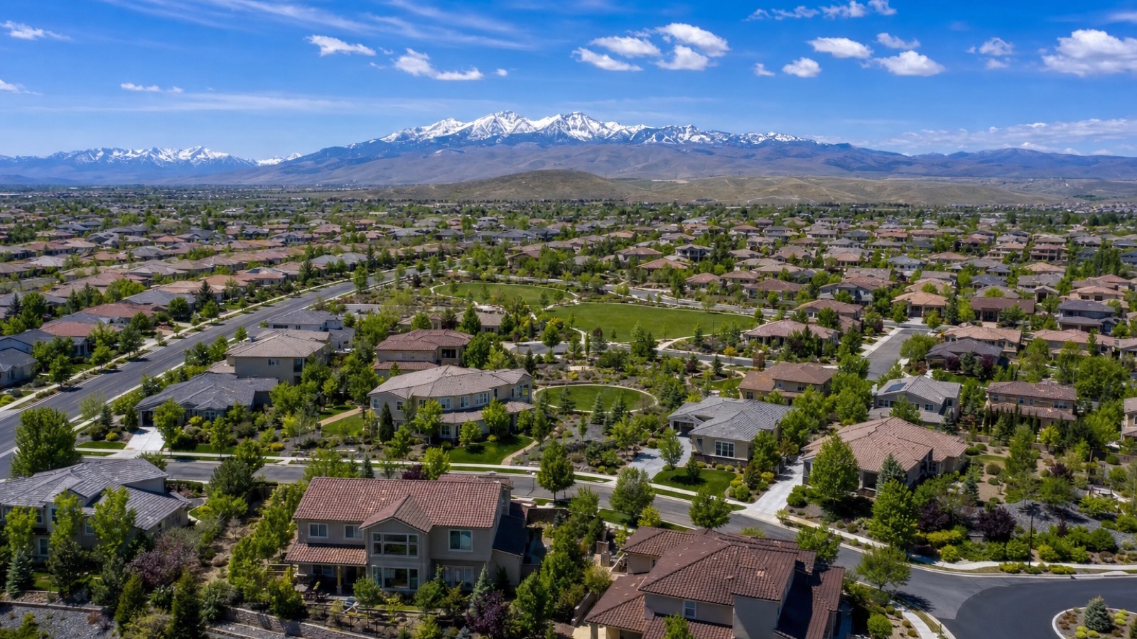 Aerial view of the South Meadows area of Reno Nevada showing established residential neighborhoods and the valley beyond