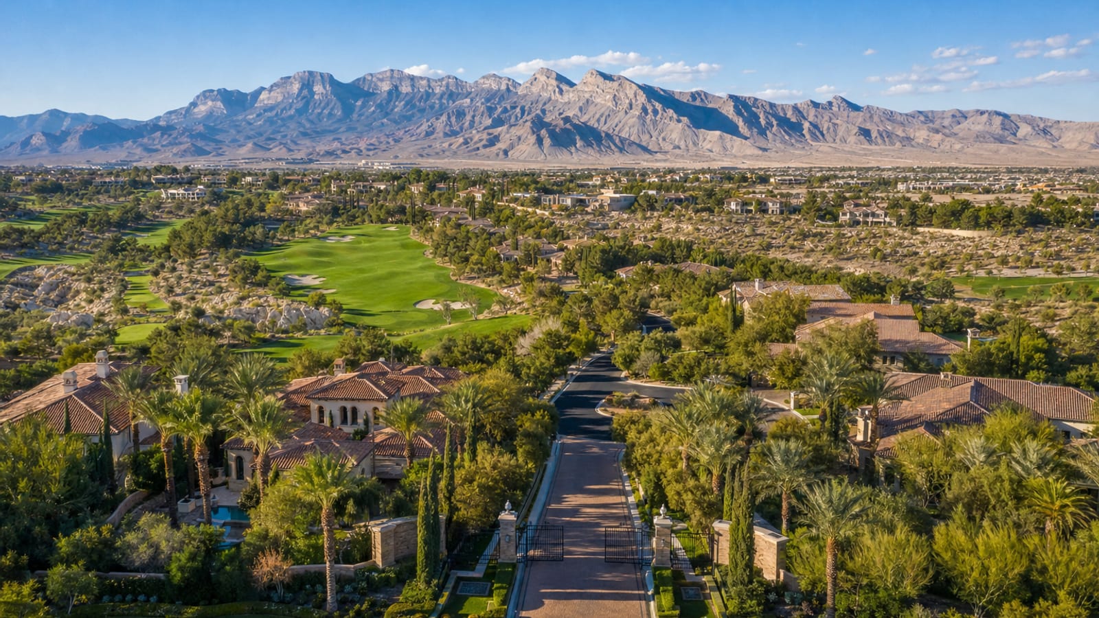 Canyon Gate Country Club Las Vegas mature palm-lined parkway with Mediterranean luxury estates at golden hour