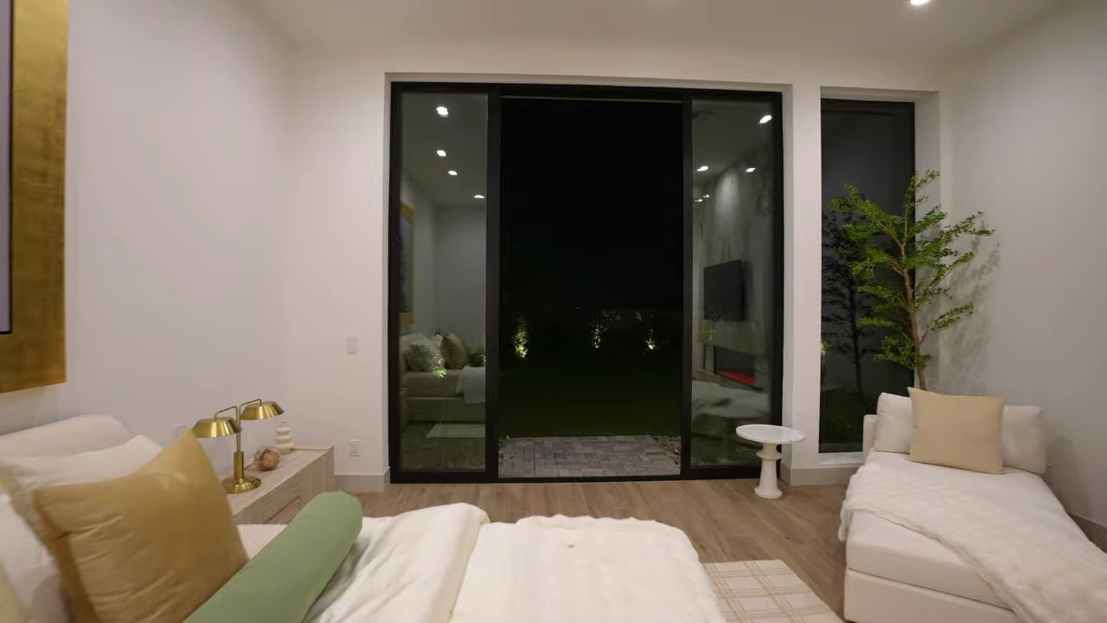 First-floor primary bedroom at 521 Overlook Rim with a sliding glass door to a private backyard entry and a sitting area