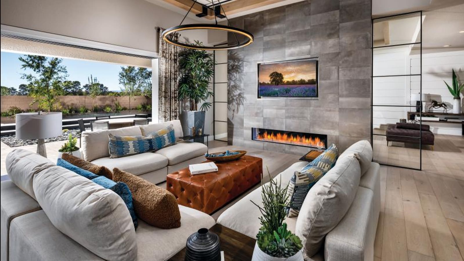 Modern kitchen with expansive center island opening into a spacious dining area