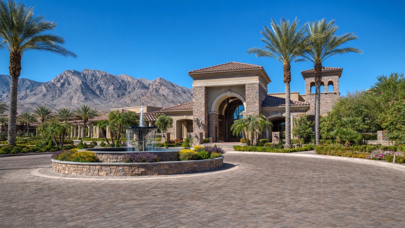Exterior of a modern 55+ community clubhouse in the Las Vegas valley with desert landscaping, the amenity center model both Del Webb communities follow