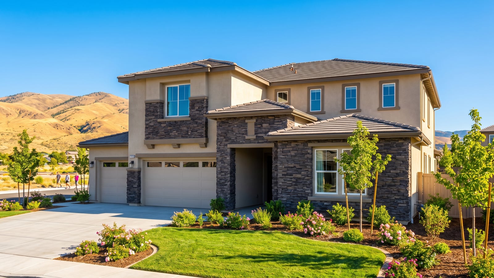 Two-story stone-accented home in Double Diamond Ranch, South Reno, with a three-car garage and Sierra foothills backdrop