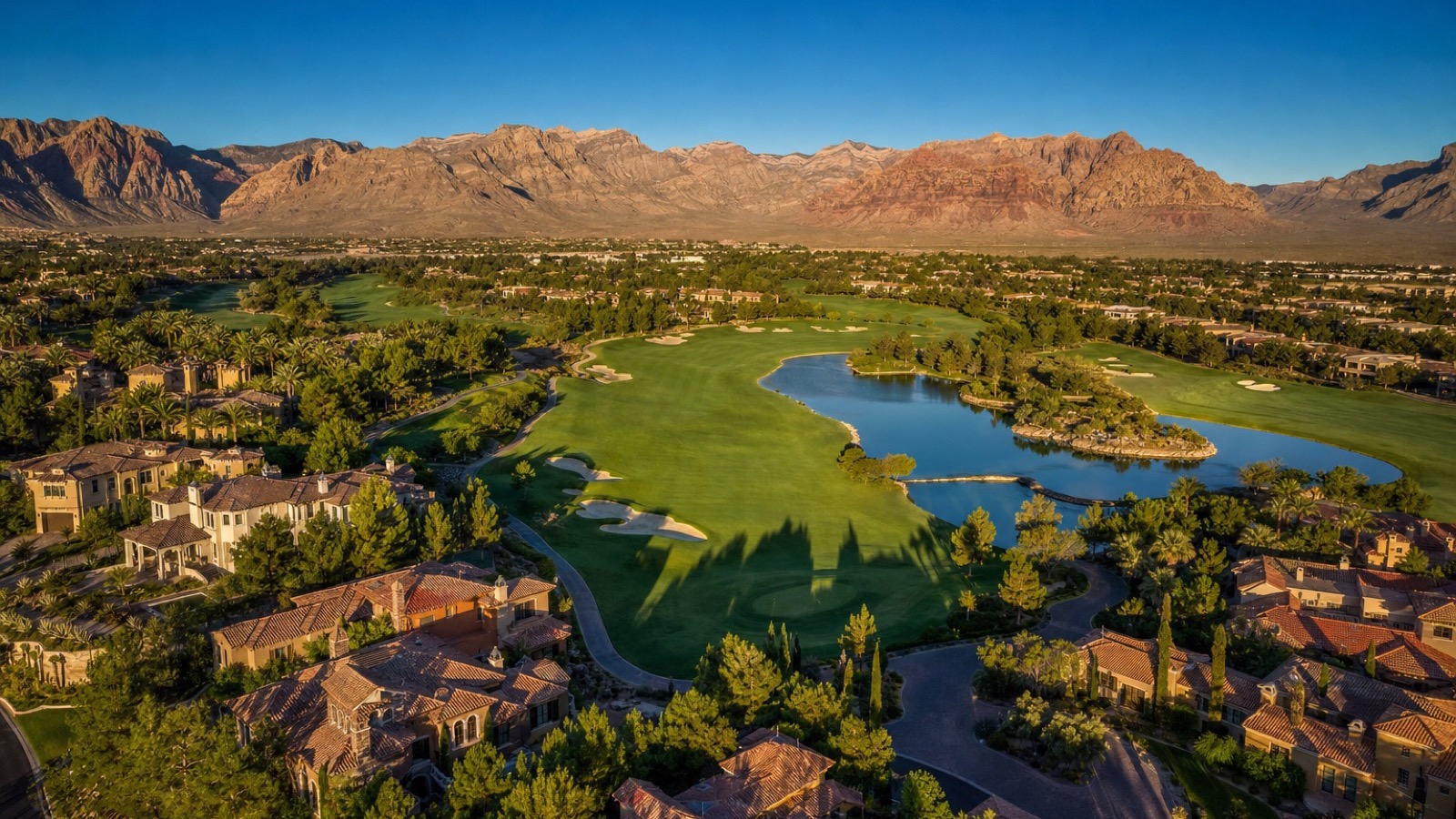 Aerial view of The Hills village in Summerlin with mature tree-lined streets, custom estates and TPC Summerlin fairways beyond