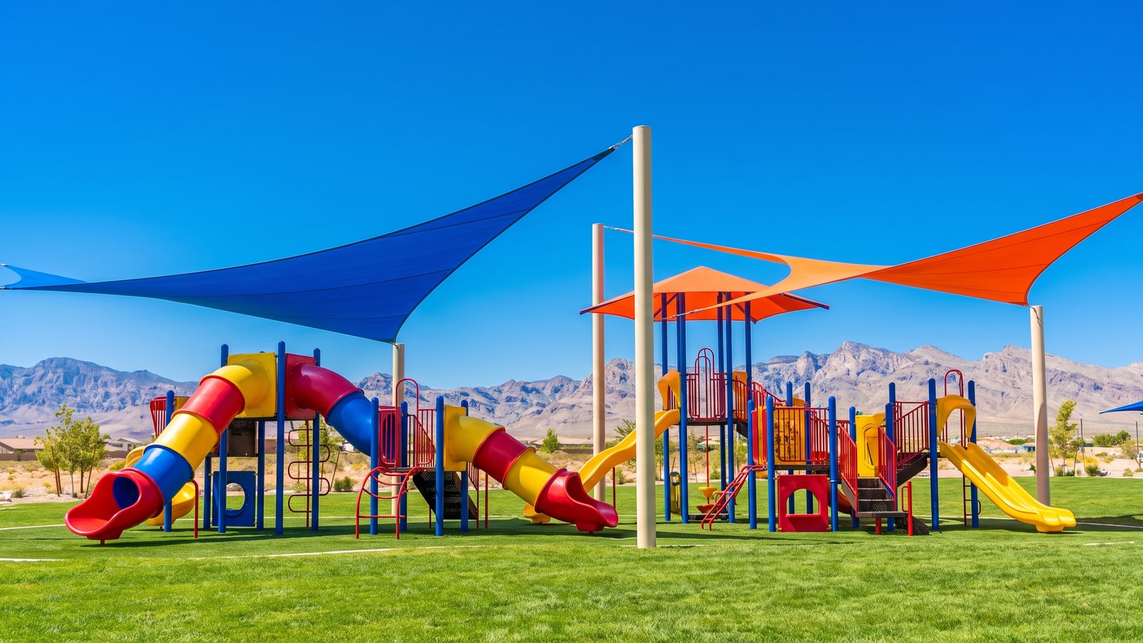 Families at a Henderson master-plan central park with splash pad, green lawns, and new-build homes surrounding