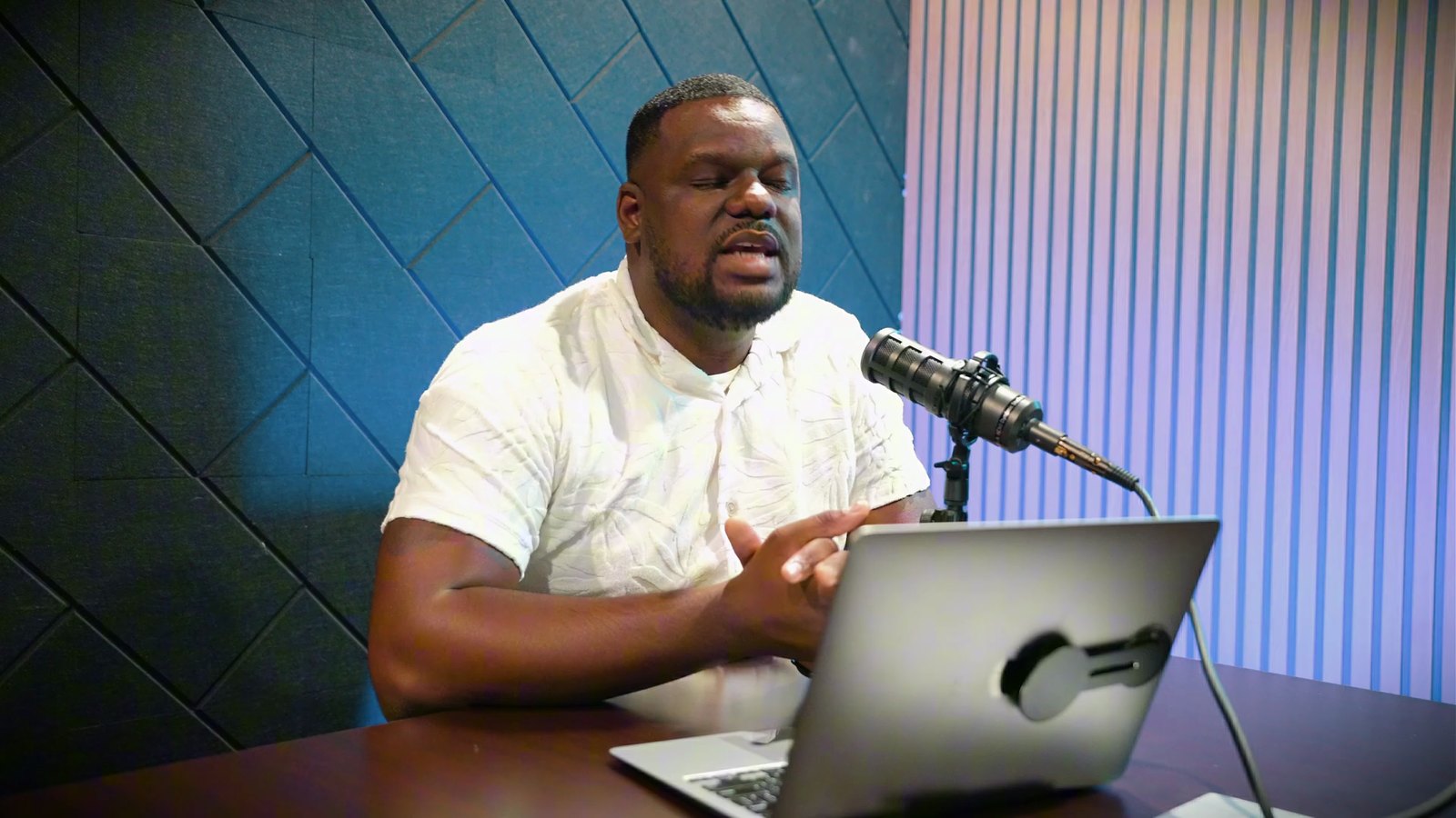 Daniel Pittman of Nevada Real Estate Group asking a question at a laptop during a Las Vegas Playbook podcast episode