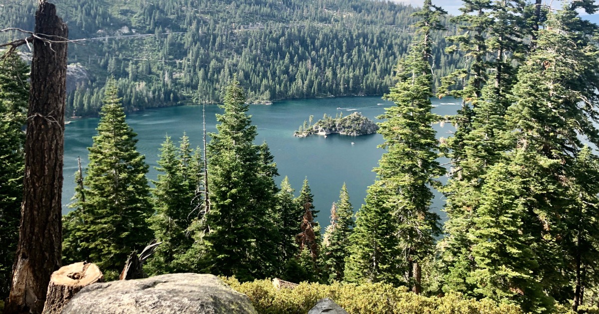 The Nevada-side Lake Tahoe shoreline with clear alpine water and granite boulders, the scarcity-driven market buyers weigh in 2026