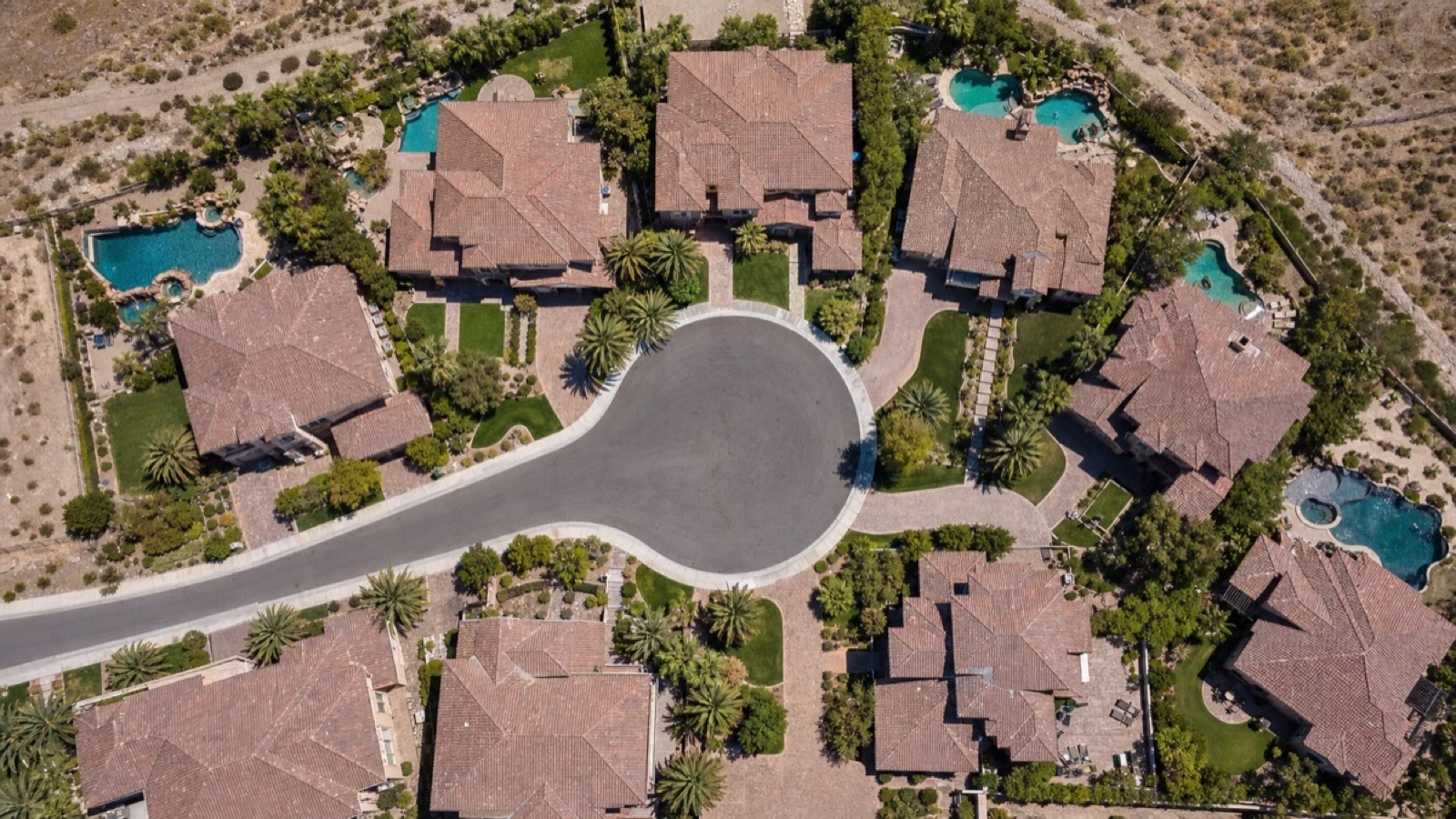 Las Vegas home buyers reviewing a purchase offer with negotiation leverage from 2026 price cut data