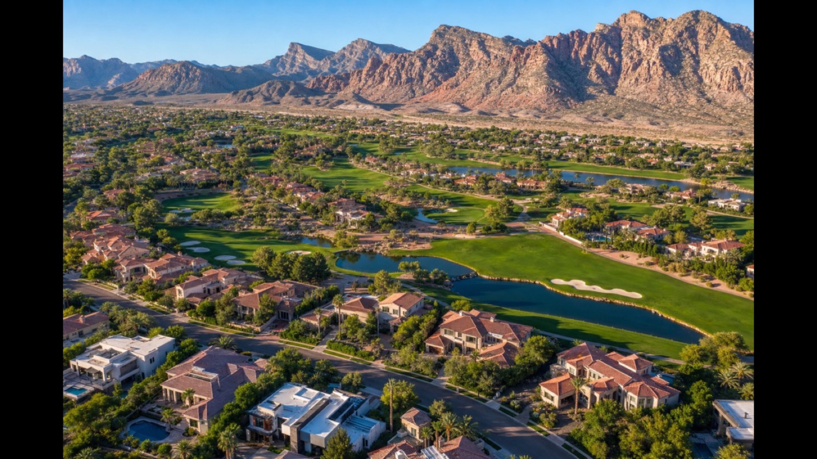 Aerial view of Red Rock Country Club golf-course homes with pools in Summerlin Las Vegas