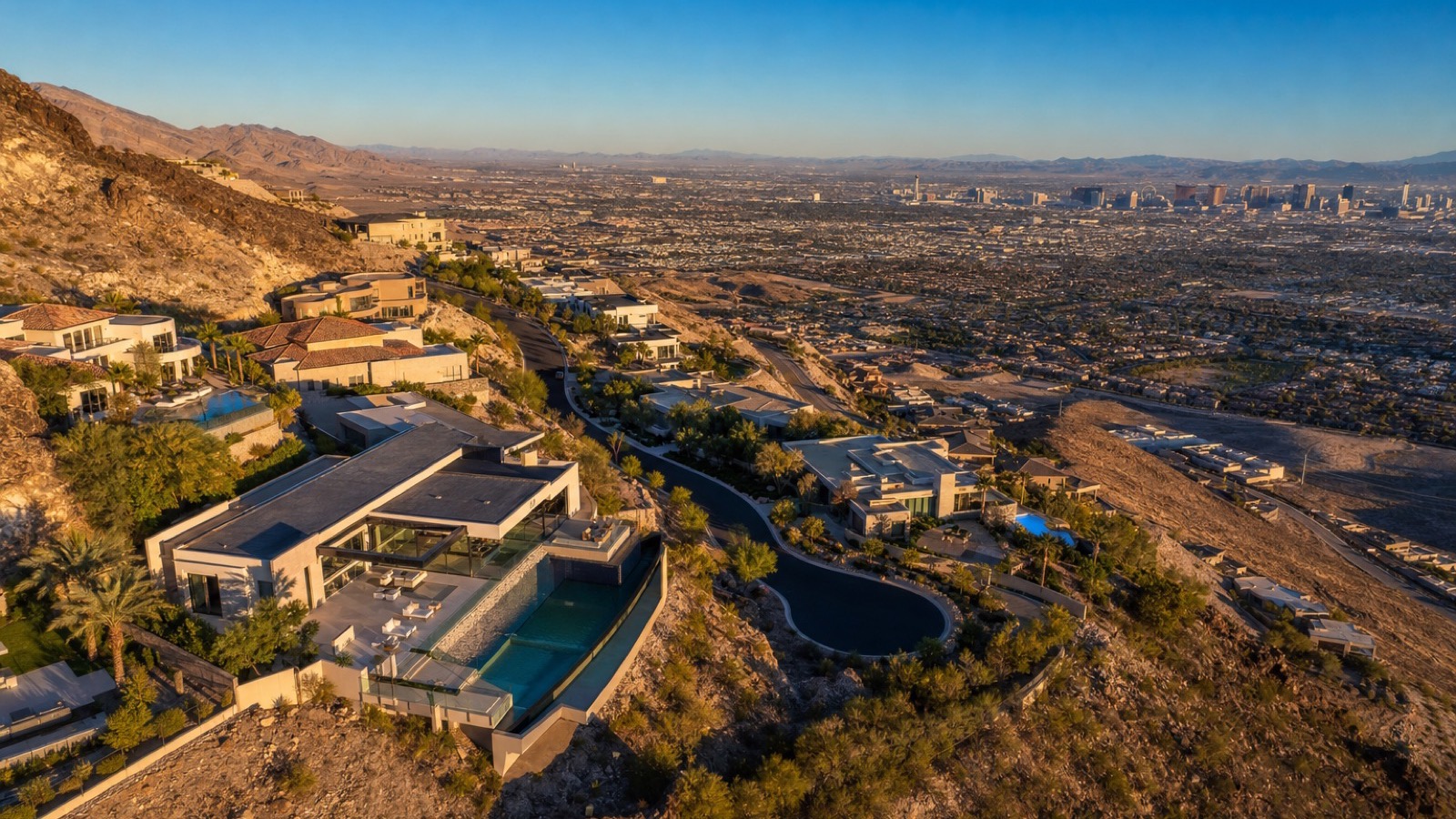 Aerial view of MacDonald Highlands guard-gated community and DragonRidge golf course in Henderson, 64 closings at a $4,300,000 median and 12.8 months of supply as of September 18, 2026