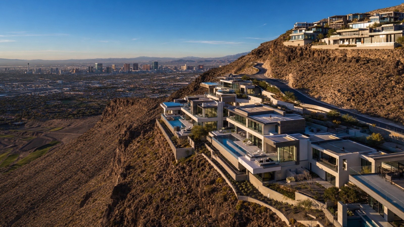 Aerial view of Ascaya in Henderson — terraced custom estate pads carved into the McCullough Range with valley views