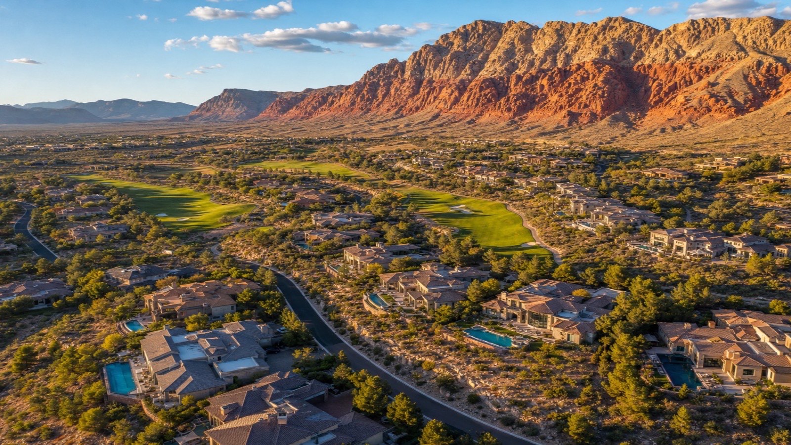 Aerial view of The Ridges in Summerlin, Las Vegas — custom mansions and golf fairways against the Red Rock foothills