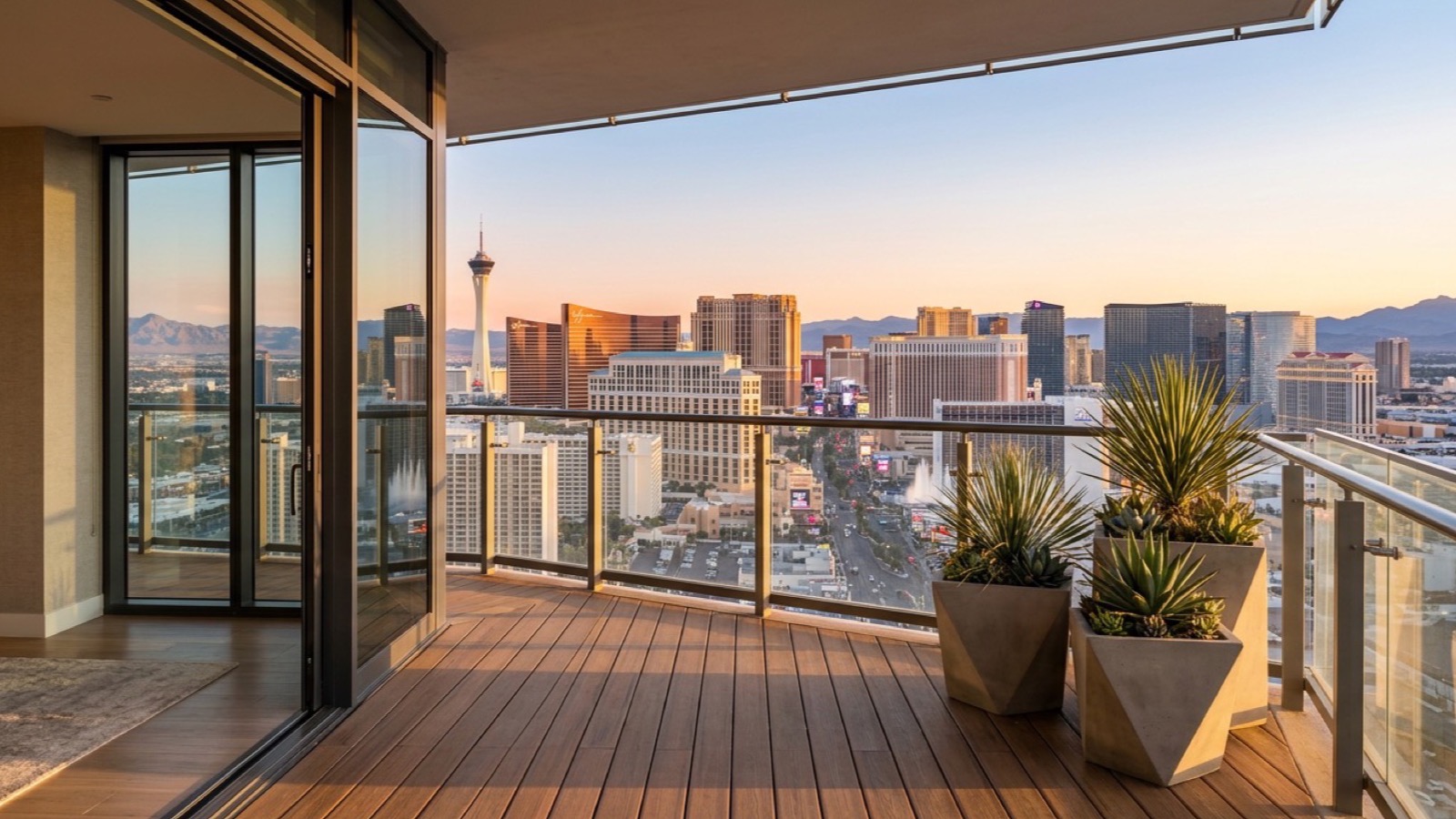 Balcony of a Las Vegas high-rise condominium overlooking the Strip at sunset, where the association's governing documents decide whether short-term rentals are allowed