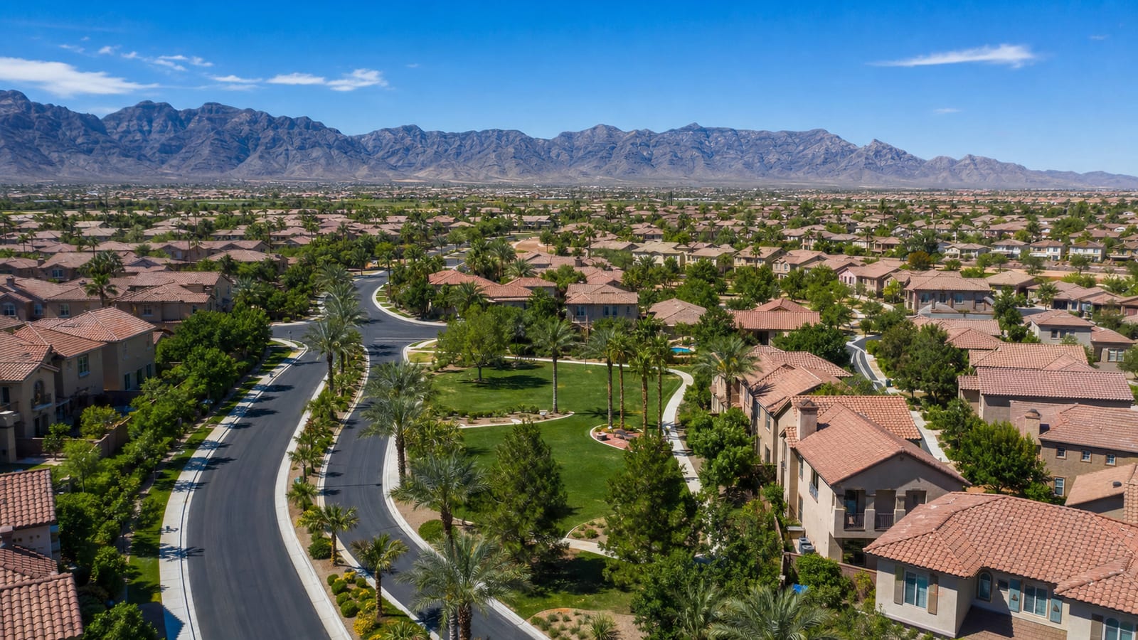 Centennial Hills suburban residential street in northwest Las Vegas with newer homes and mountain backdrop