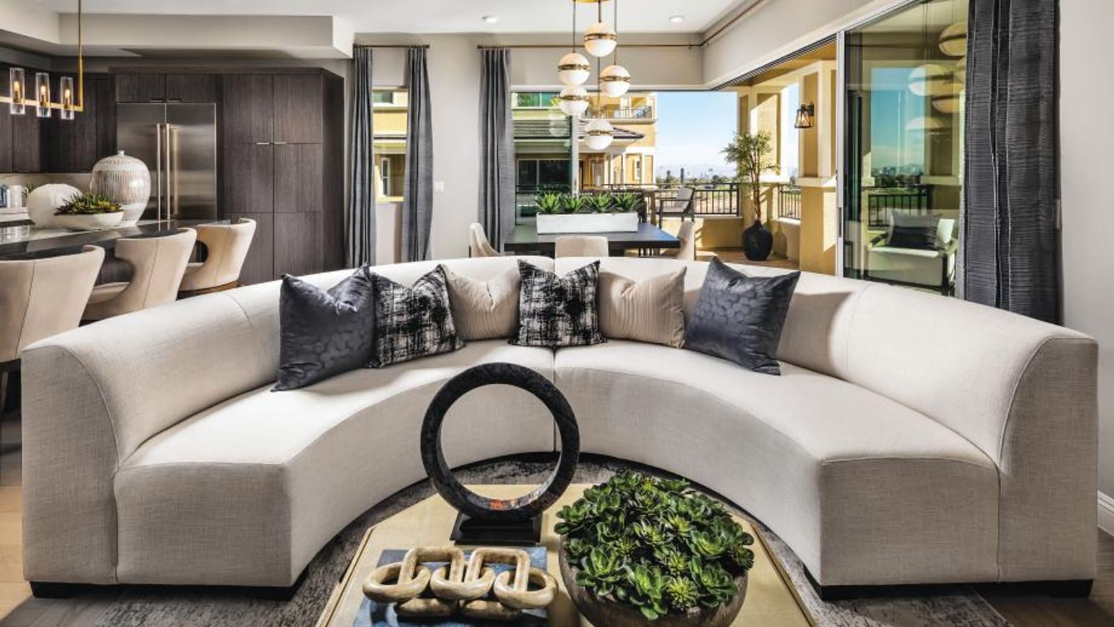 Representative builder image showing an interior view of a great room showcasing kitchen and dining integration