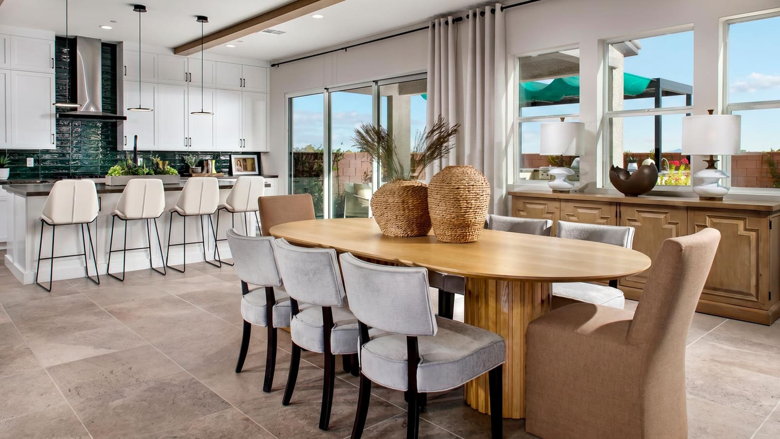 Representative builder image showing an open kitchen and dining transition