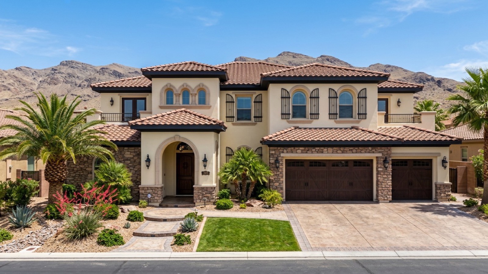 Two-story Las Vegas home with a concrete tile roof, stucco walls, stone accents and desert landscaping, the materials a pre-listing inspection examines first