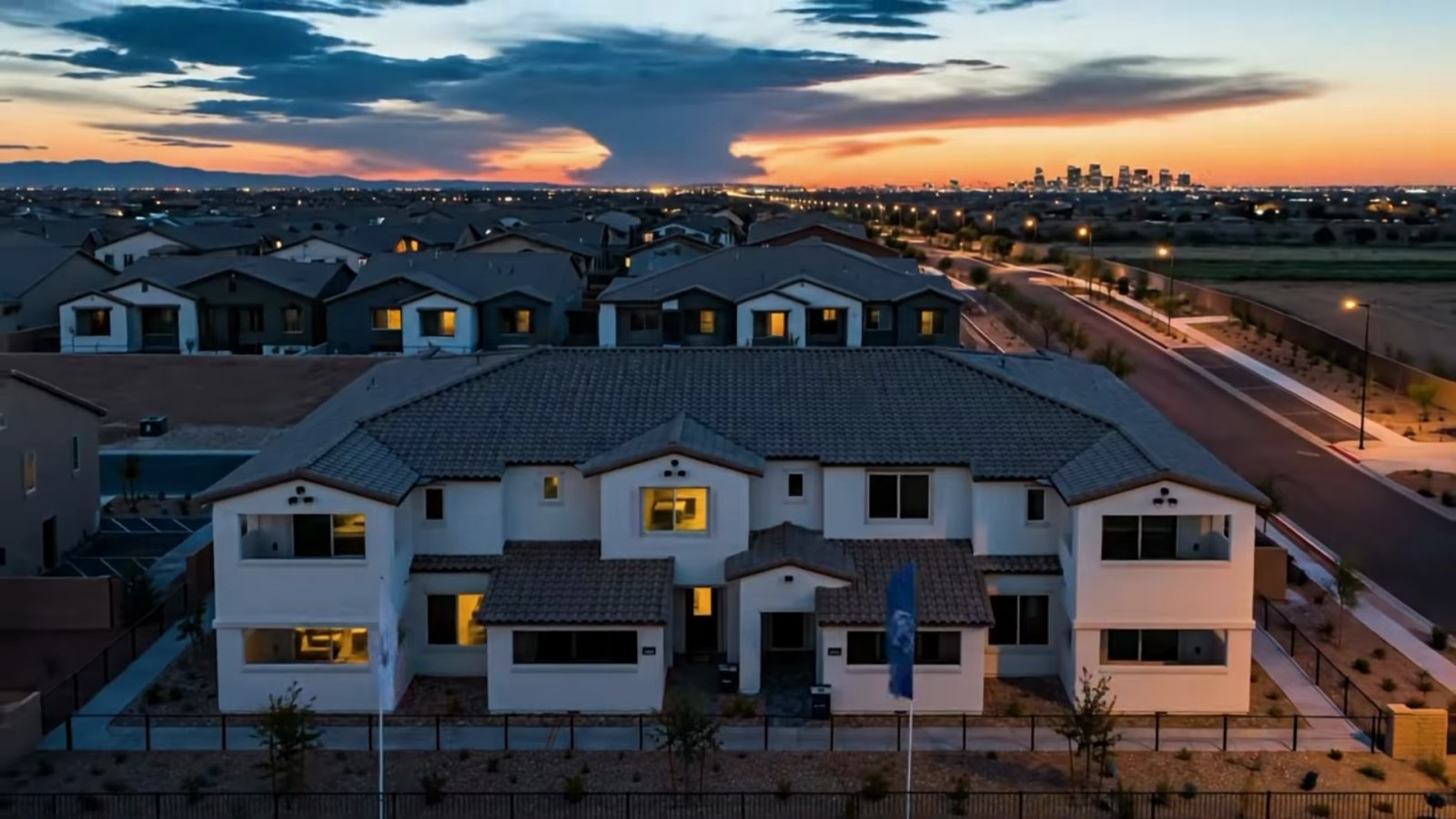 Dusk aerial view of Pulte's Dalea at Aries townhomes in east Henderson with the Las Vegas skyline in the distance