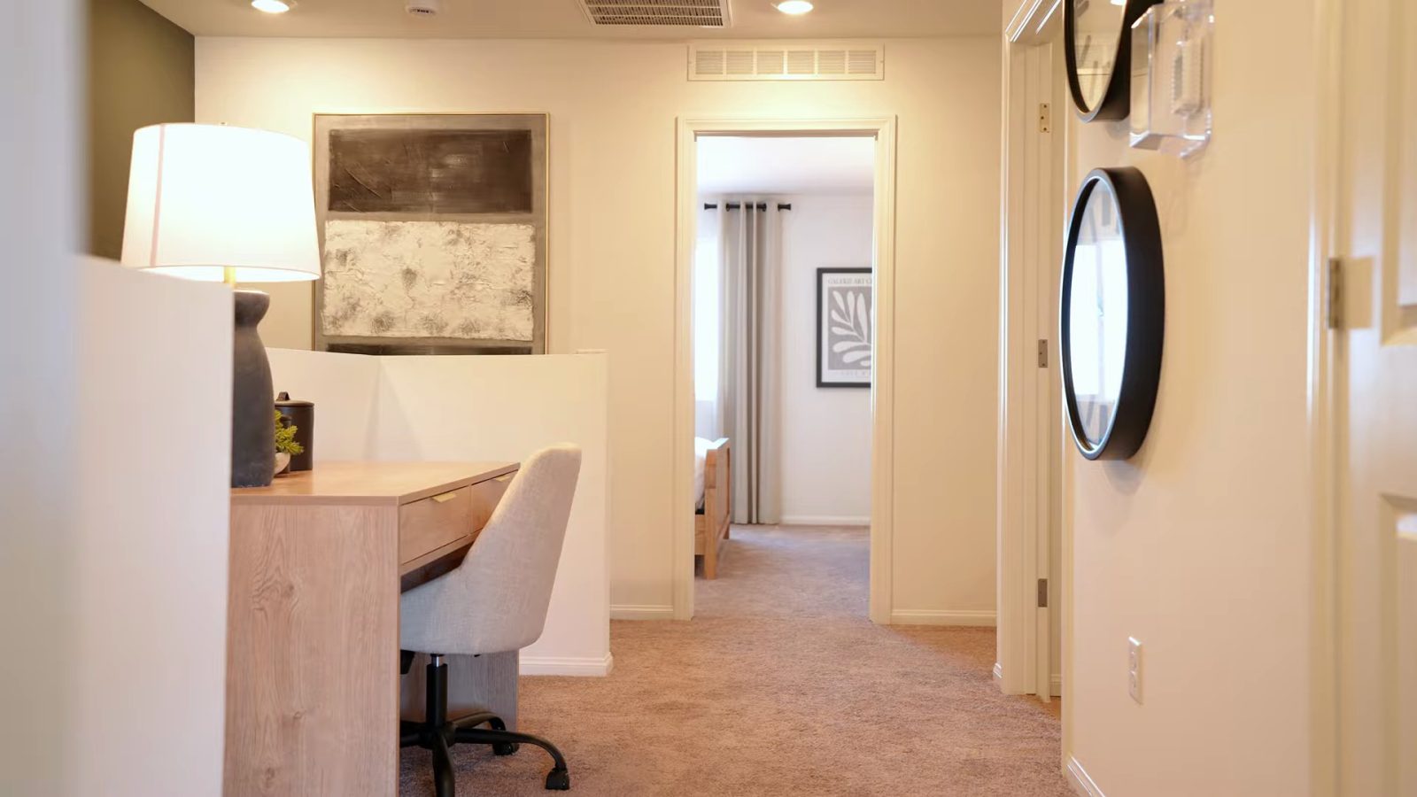 Upstairs landing in the Pulte Cornwall model at Dalea at Aries staged with a desk and chair between the two primary suites