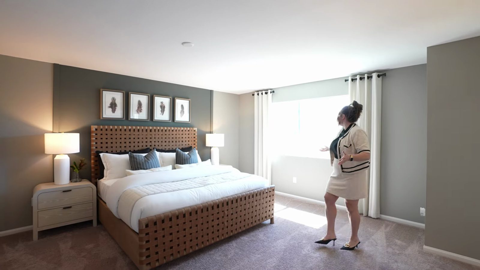 Larger primary suite bedroom in the Pulte Cornwall model at Dalea at Aries with a king bed, two nightstands and a large window