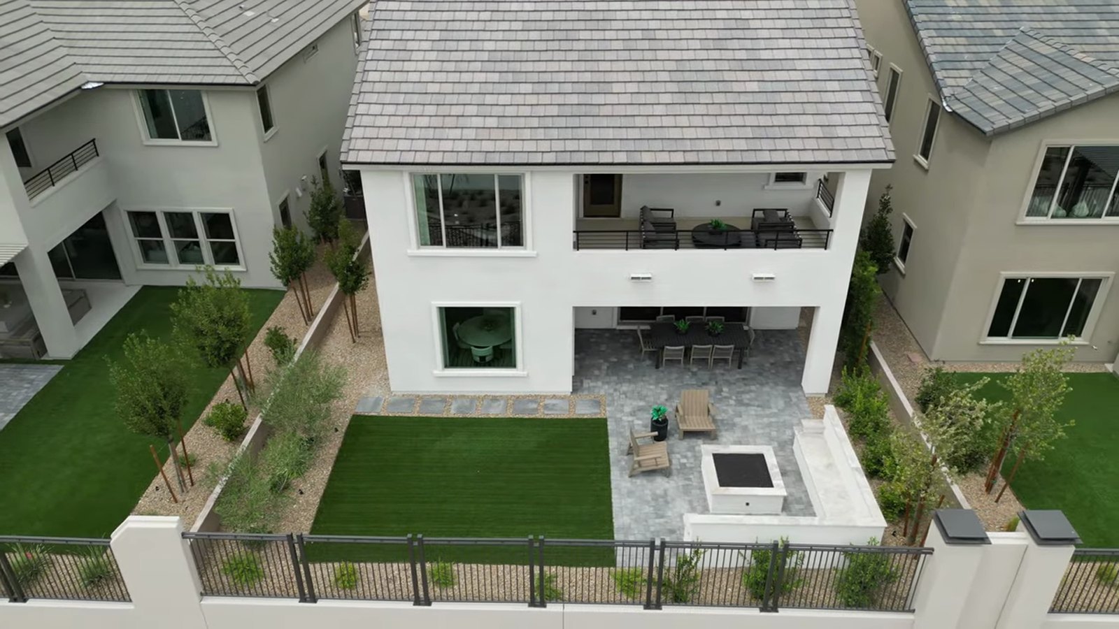 Aerial view of the Pulte Tivoli model's finished backyard at Brantley with turf, a fire feature, patio furniture and desert landscaping