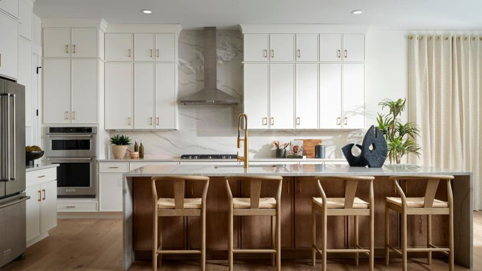 Representative modern kitchen interior with large island and bright lighting
