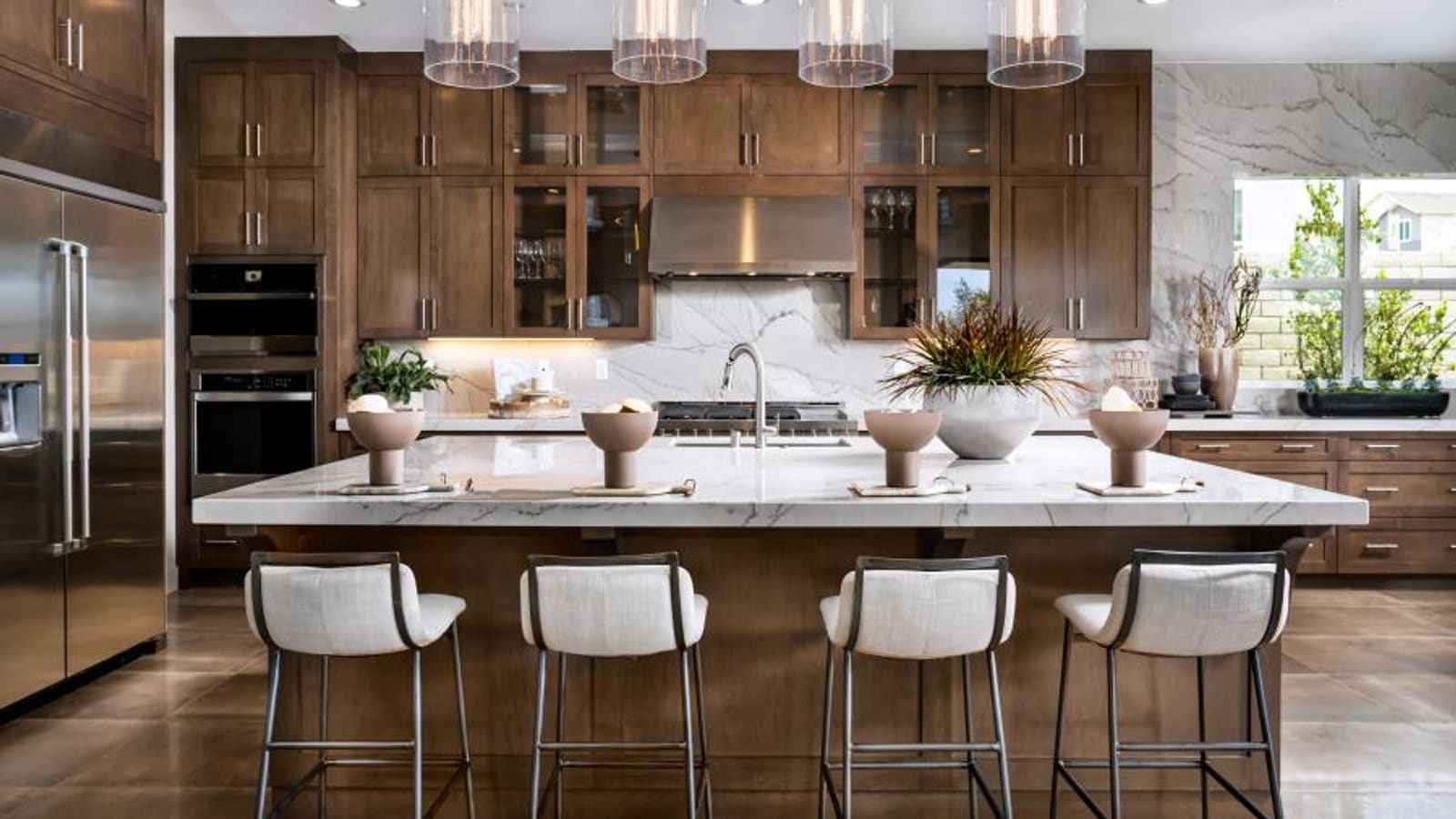 Bright kitchen featuring expansive countertops and contemporary cabinetry