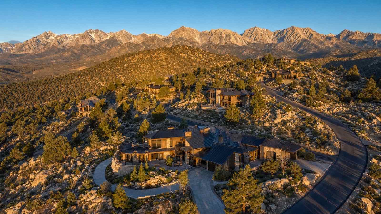 Hillside estate homes among granite boulders and pines in Saddlehorn, south Reno, at golden hour