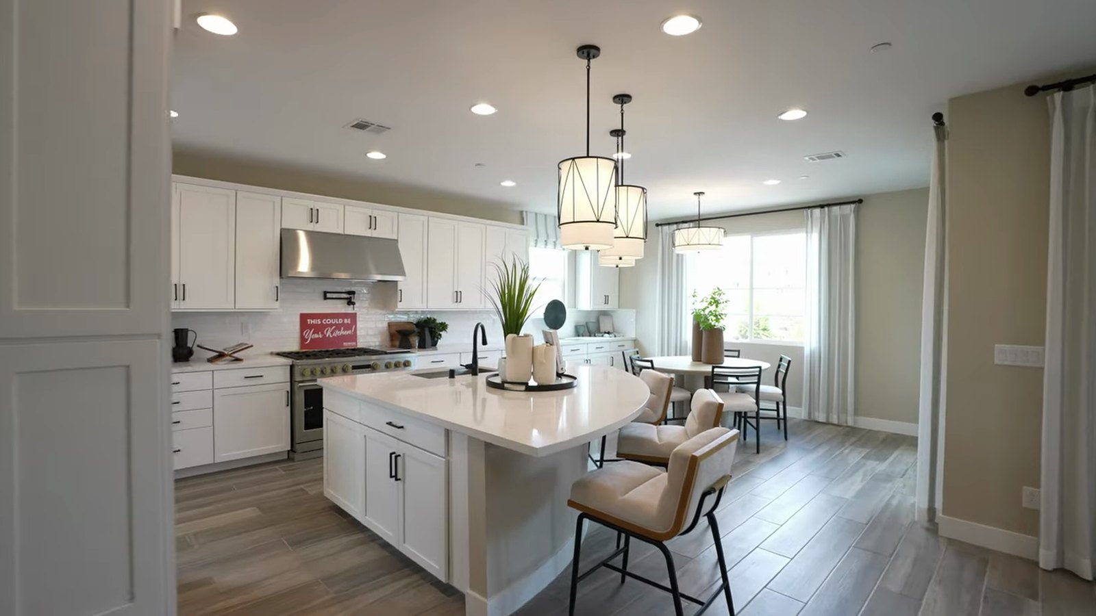 Upgraded pro kitchen in the Richmond American Dayton model at Silver Bow with a quartz island and Monogram range