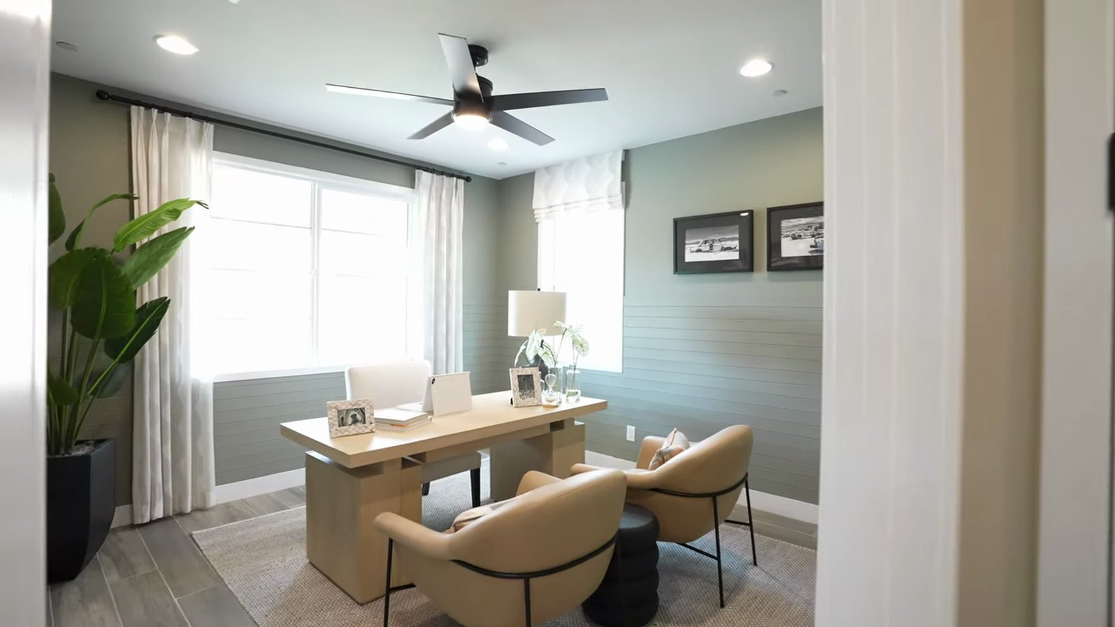 Main-floor study in the Richmond American Dayton model at Silver Bow with a desk and two armchairs