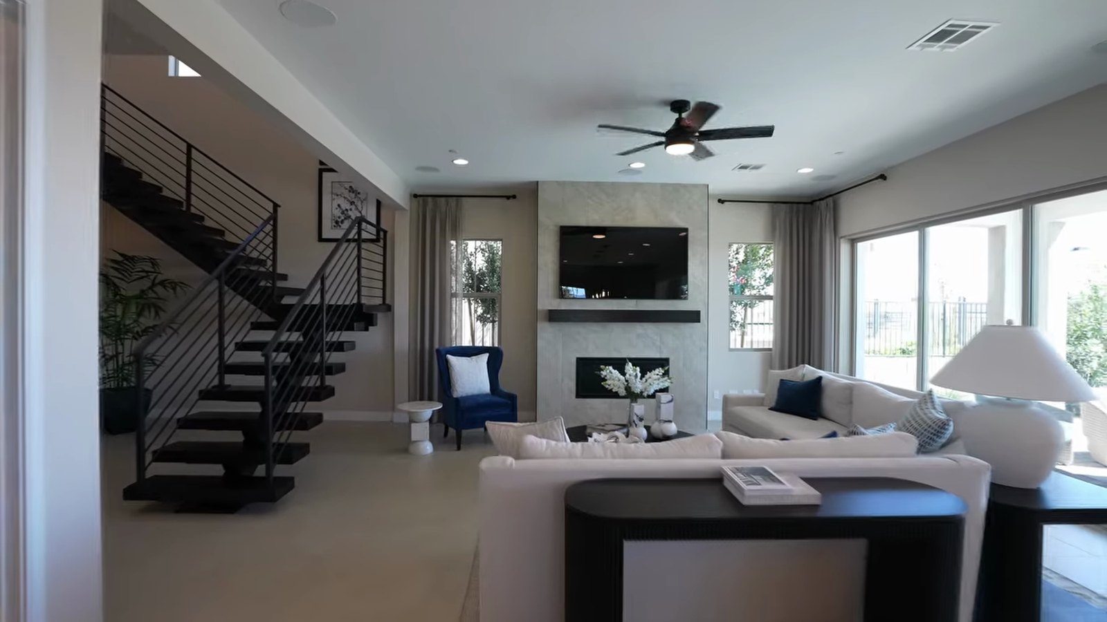 Floating staircase and great room with fireplace in the Richmond American Teton model in Summerlin West