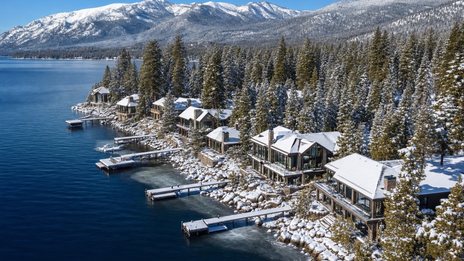 Snow-covered Incline Village rooftops above Lake Tahoe where ground snow loads and ice barrier underlayment requirements apply