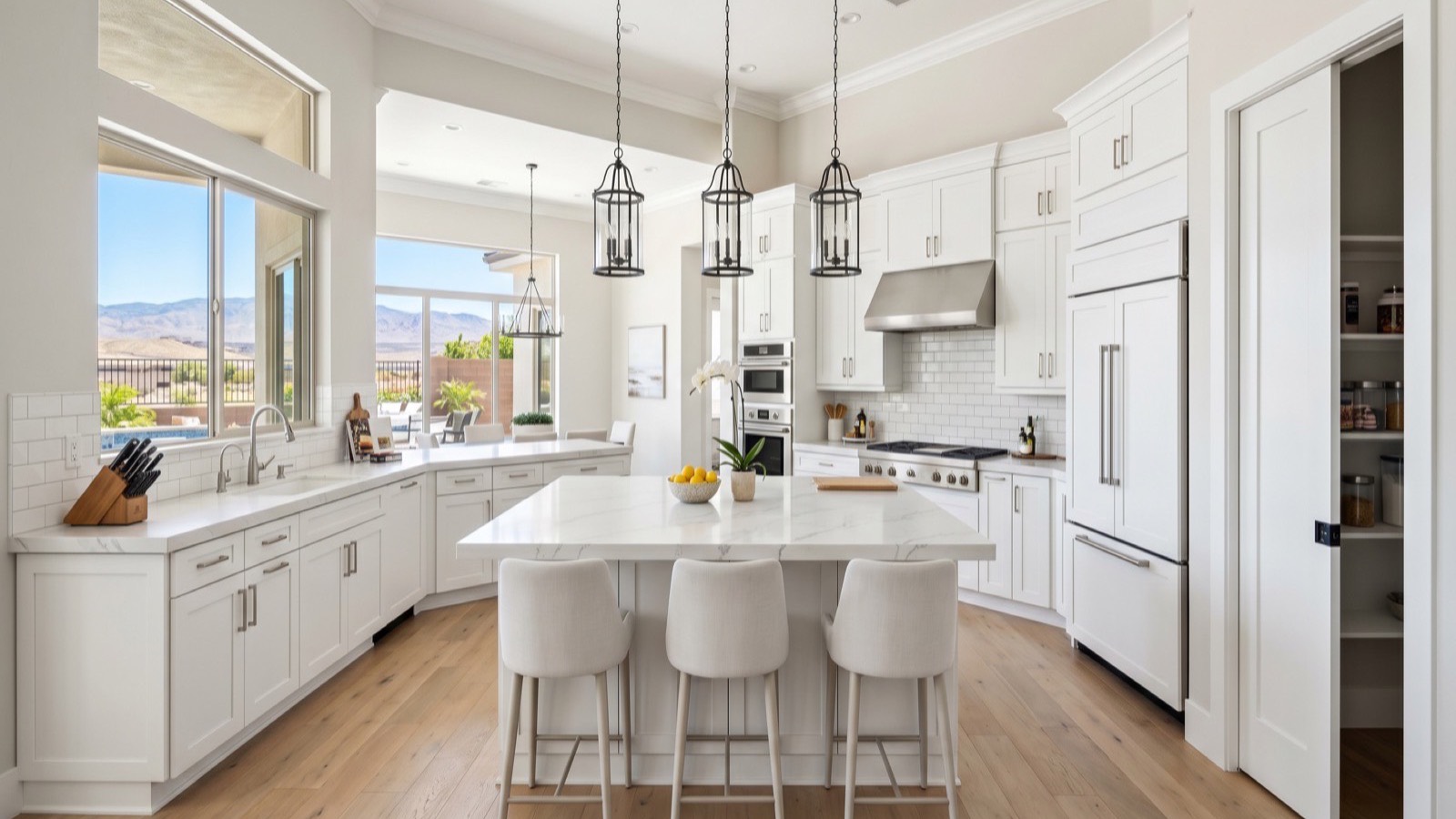Renovated white kitchen with a stone-topped island and pendant lights in a Las Vegas home, the finished comparable an as-is buyer prices a fixer against