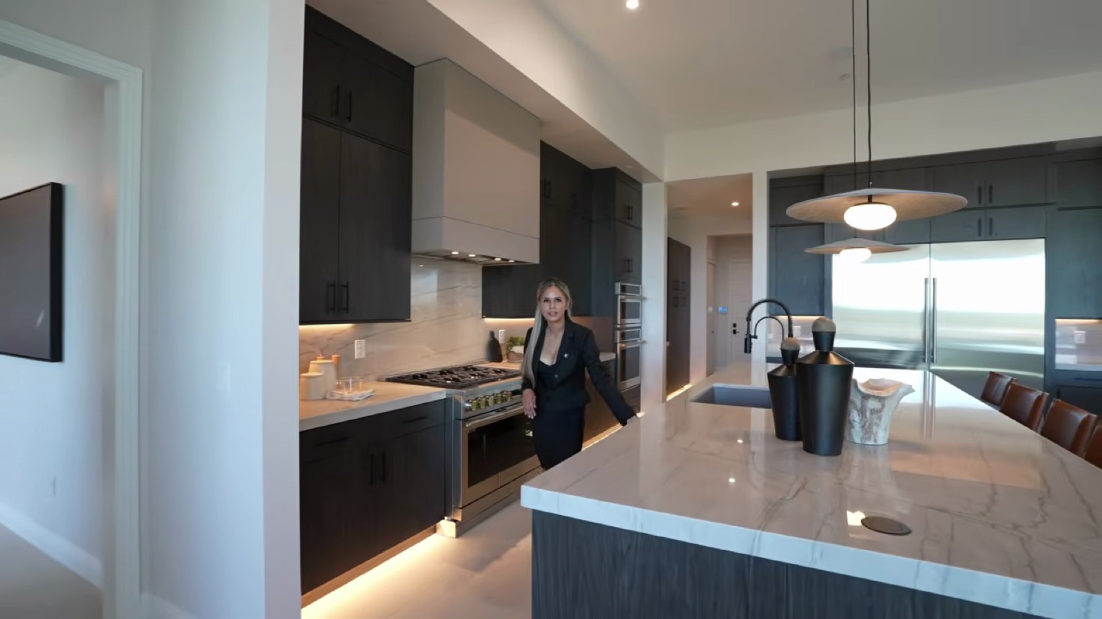 Shawood Towa model kitchen with two islands, dark cabinetry stacked to the ceiling and a built-in refrigerator