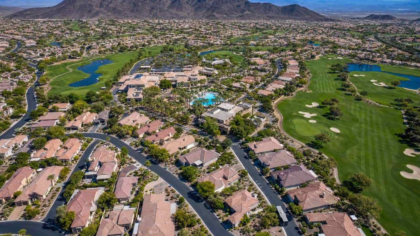 Solera at Anthem guard-gated entry and single-story Del Webb homes in Henderson Nevada with desert landscaping and mountain backdrop