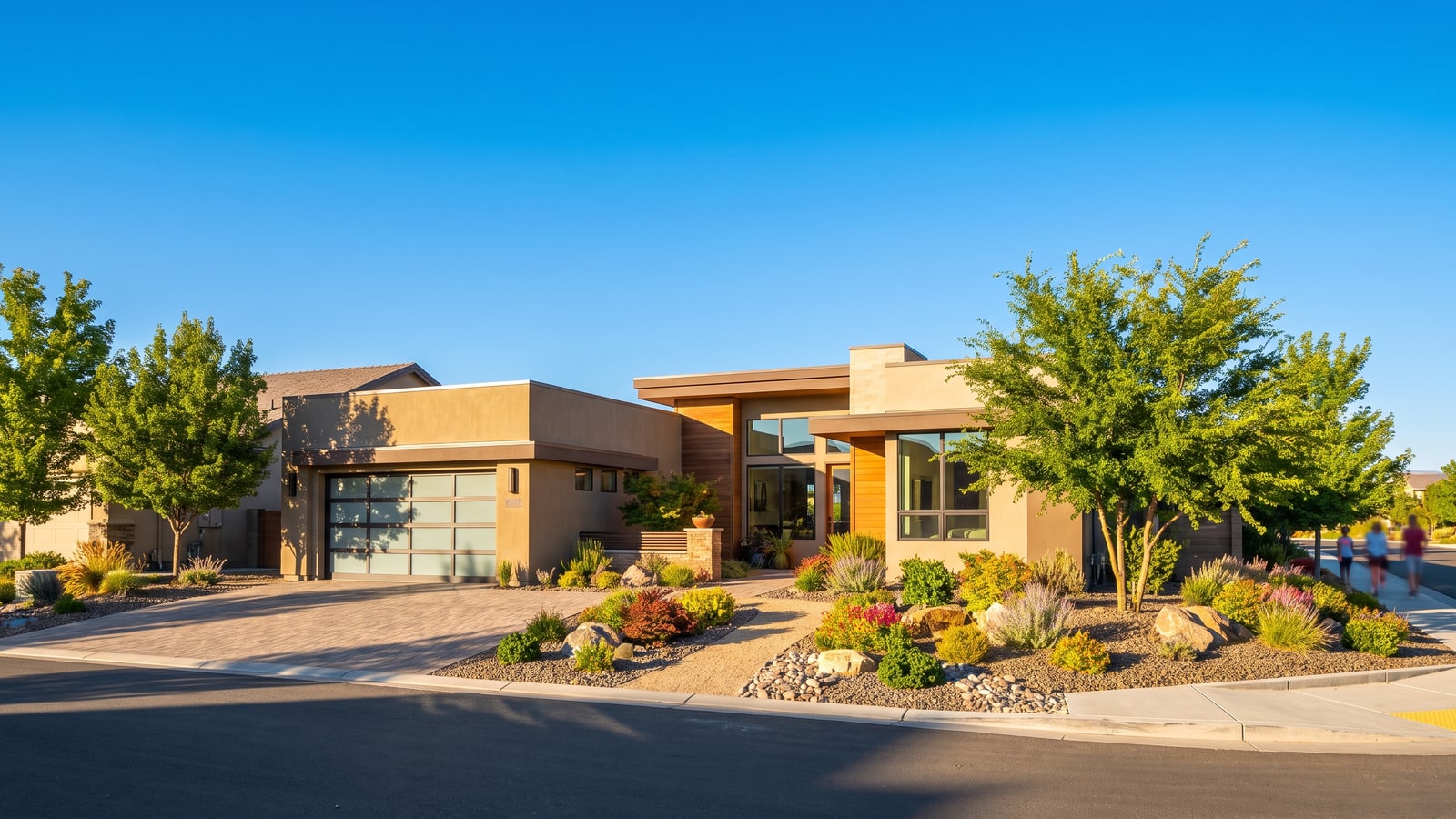 Bright single-story modern home in South Meadows, Reno, with desert-friendly landscaping and a two-car garage under a clear blue sky