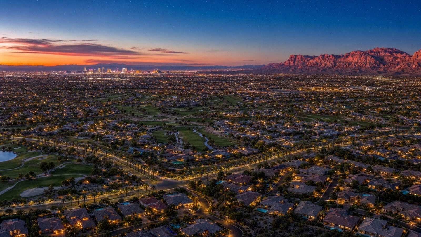 Twilight aerial view over Summerlin Las Vegas villages showing the range of housing stock a listing agent prices by tier