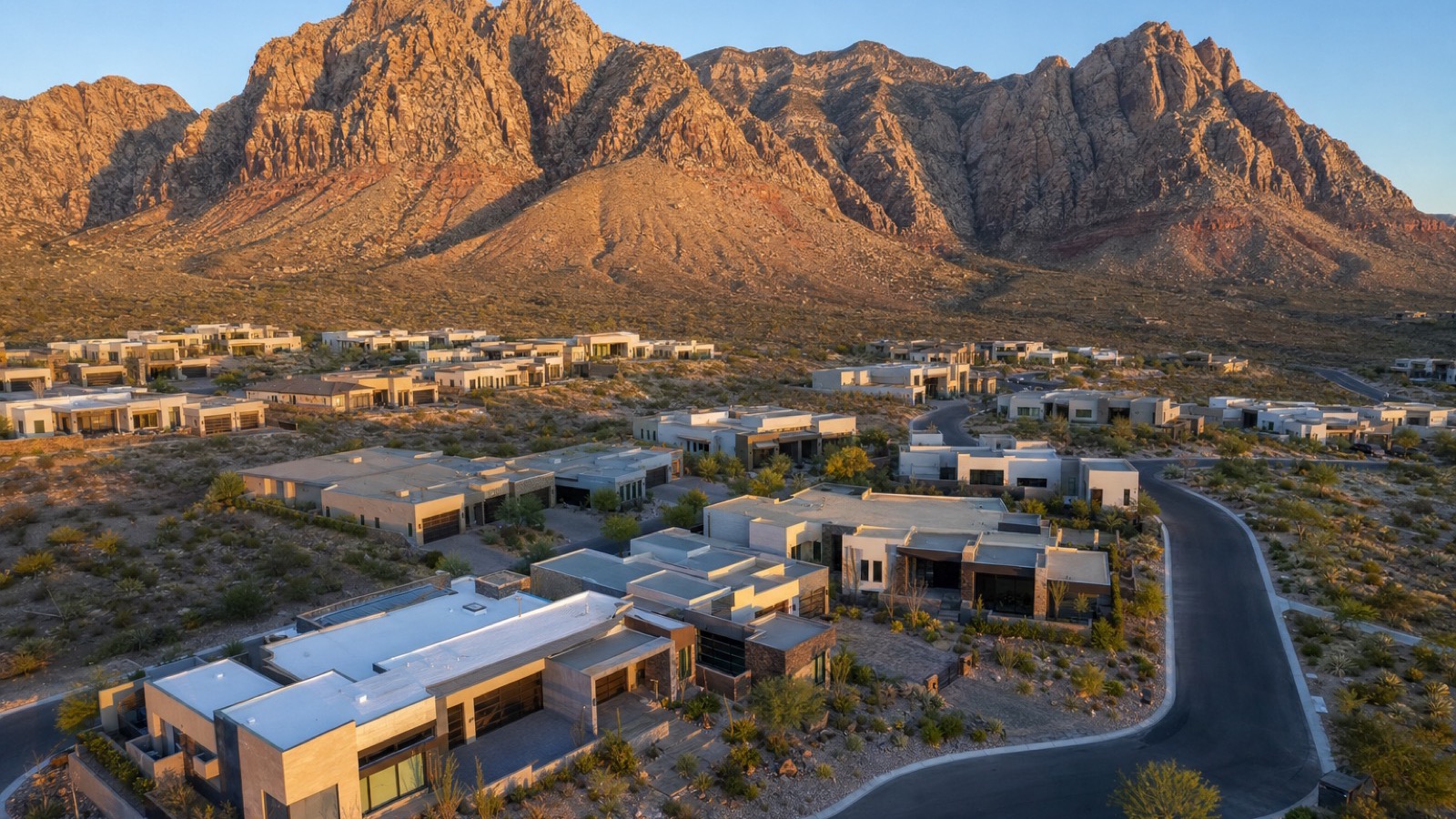 Aerial view of The Cliffs village in Summerlin West with newer-construction residential pads and Red Rock Canyon visible in the background