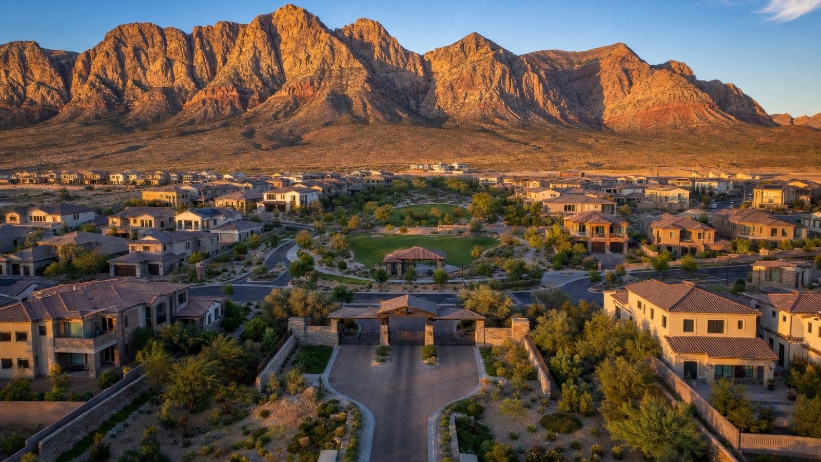 Hilltop streetscape of newer Pulte luxury homes in Reverence Summerlin with Strip and Red Rock views