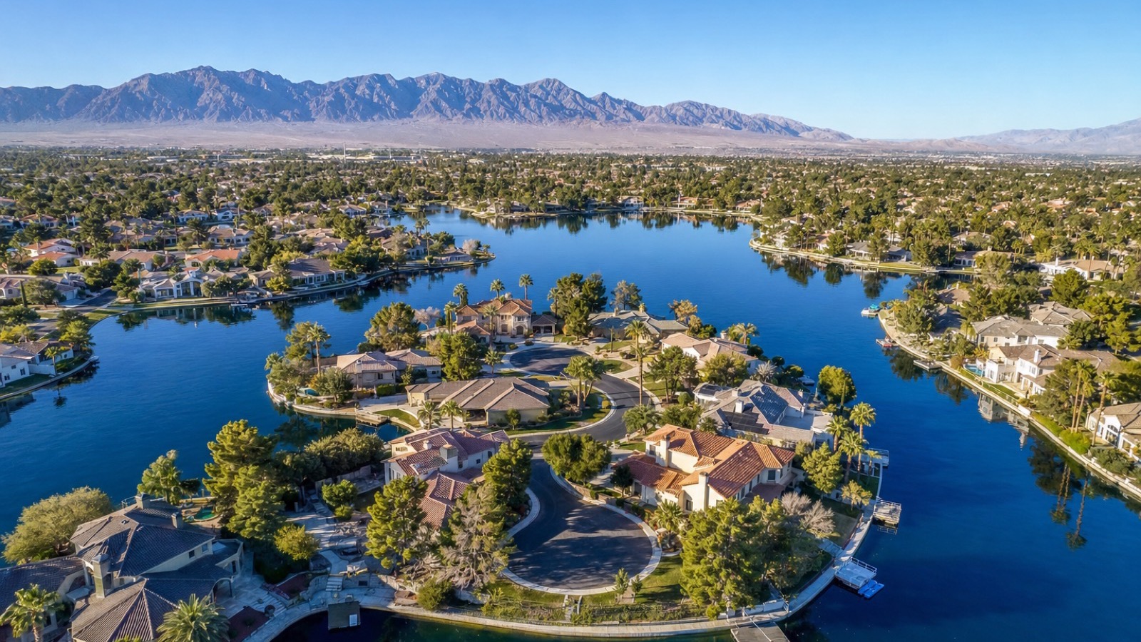 The Lakes west Las Vegas waterfront residential village with Lake Sahara visible in the background and lakefront homes lining the shore